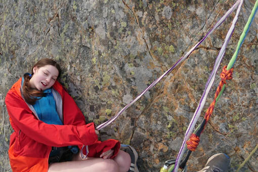 A small image of two people abseiling together