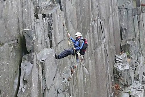 A large image of a person abseiling