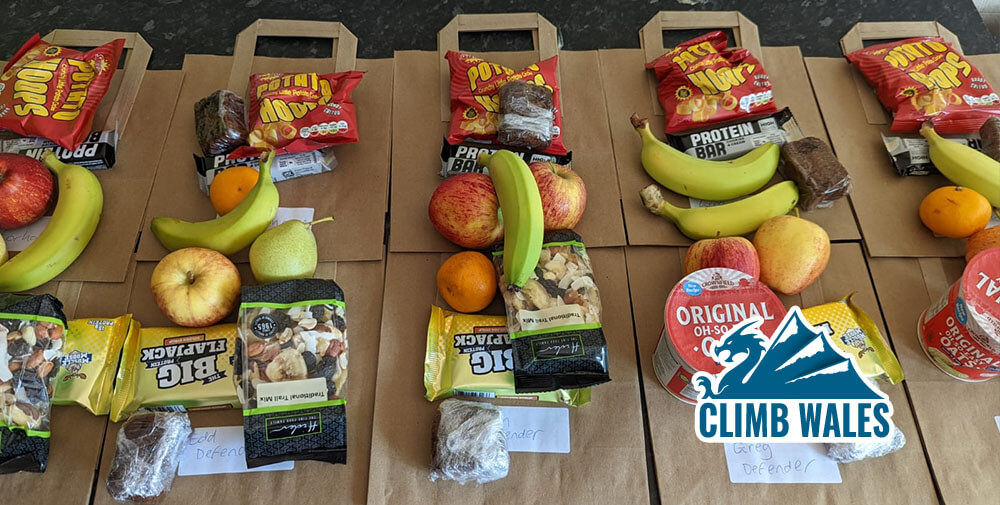 Bananas, flapjack and other snacks laid out on a paper bag