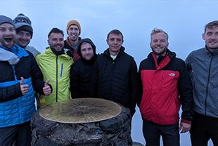 A group of young men at the summit of Snowdon and about to start the Welsh 3000s